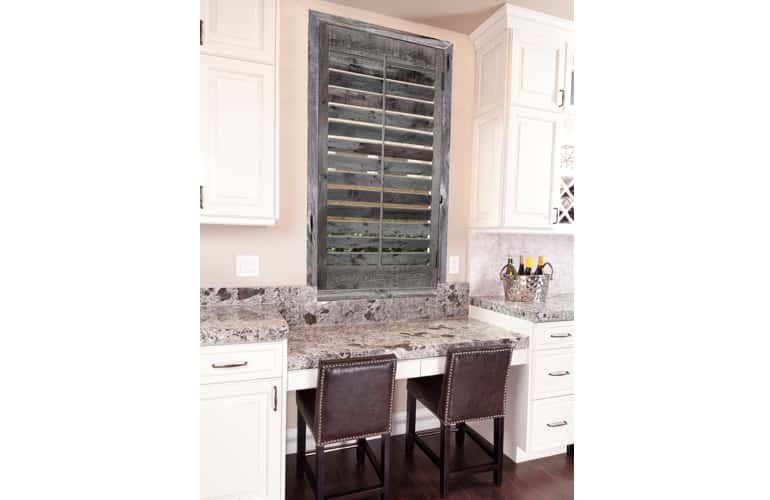 Reclaimed wood shutters on kitchen window in New Brunswick